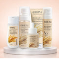 Set of ORUM skincare products standing on a stand against a clean light pink background